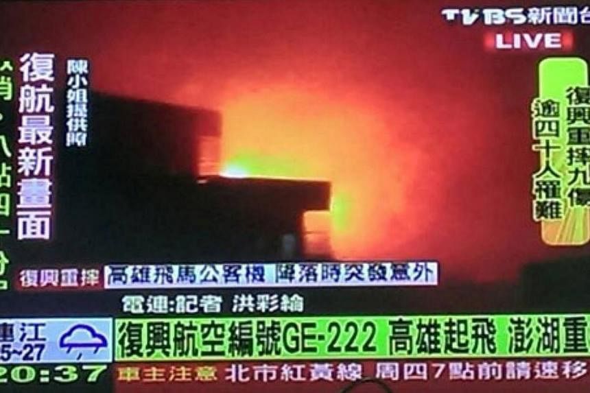 A screengrab from a TVBS report,&nbsp;after a TransAsia Airways plane carrying 58 people from Taiwan's Kaohsiung crashed into two houses, killing dozens of people.&nbsp;-- PHOTO: TVBS