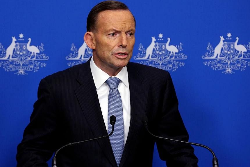 Australian families affected by the MH17 tragedy will be offered the opportunity to go to the Netherlands to travel home with the bodies of victims, Prime Minister Tony Abbott said on Wednesday. -- PHOTO: AFP