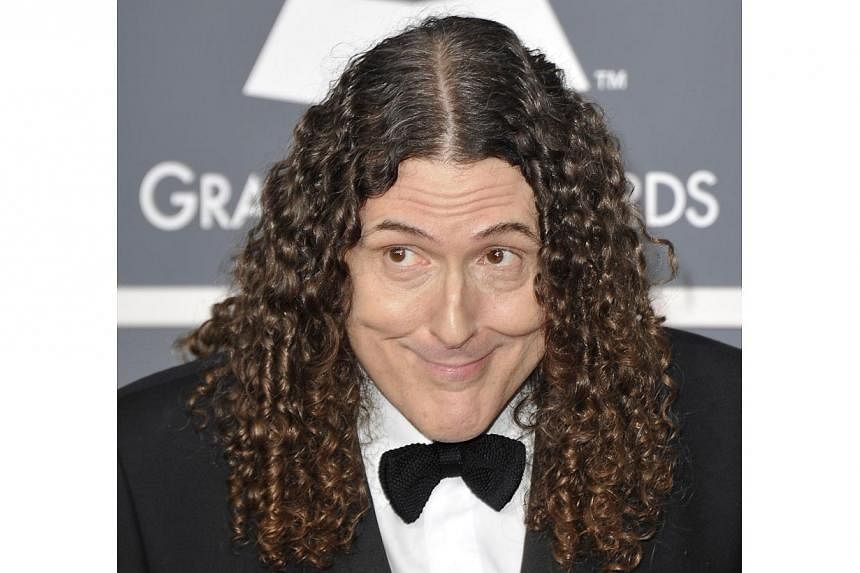 In this 2012 file photo, US comedian-singer "Weird Al" Yankovic arrives at the Staples Center for the 54th Grammy Awards in Los Angeles, California. "Weird Al" Yankovic on July 23, 2014 has scored a career-first number one album following a viral vid