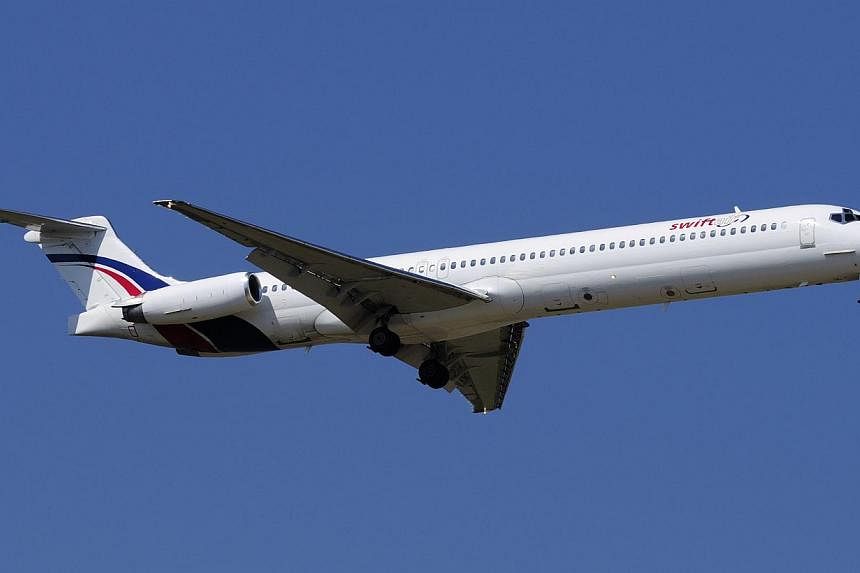 A Swiftair MD-83 airplane is seen in this undated photo.&nbsp;There were likely many French passengers on the Air Algerie flight which disappeared en route from Ouagadougou in Burkina Faso to Algiers, France's transport minister said. -- PHOTO: REUTE