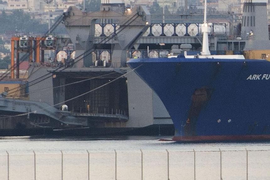 Danish ship Ark Futura (right) is docked next to US ship Cape Ray at the port of Gioia Tauro, southern Italy, on July 2, 2014 for the transfer of chemical weapons from Syria to be destroyed.&nbsp;All the toxic chemicals removed from Syria under a dea