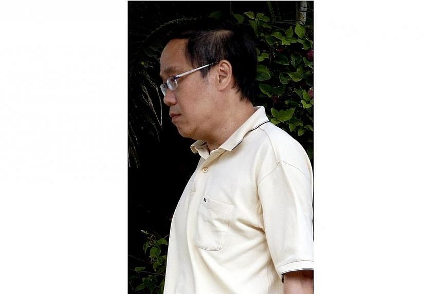 Teh Thian Seng, 50,&nbsp;a former engineer who took upskirt videos of unsuspecting women on escalators at shopping malls and MRT stations was jailed for three weeks on Friday, July 25, 2014. -- ST PHOTO:&nbsp;WONG KWAI CHOW