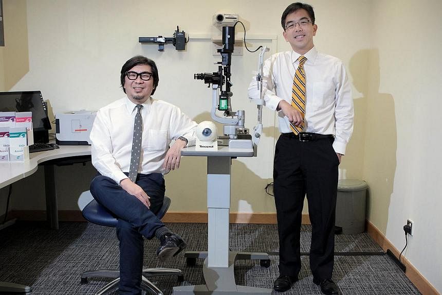 Professor Donald Tan (left) and Professor Wong Tien Yin from the Singapore National Eye Centre. Prof Tan will relinquish his post as medical director of the Singapore National Eye Centre, with Prof Wong taking over from Aug 1, or next Friday. -- ST P