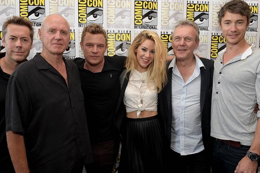 (From left) Executive producer Vaun Wilmott, actor Alan Dale, actor Christopher Egan, actress Roxanne McKee, actor Anthony Head, and actor Tom Wisdom attend the Dominion Press Line during Comic-Con International 2014 at Hilton Bayfront in San Diego, 
