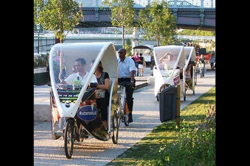 Cyclopolitains: These modern electric tricycles (above) are driven by young drivers called Cyclonauts who are friendly and double as tour guides. It costs €1 a kilometre a person. -- PHOTO: LYON TOURISM AND CONVENTIONS