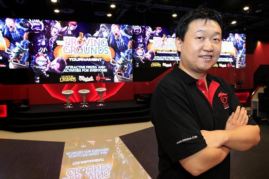 Co-founder Forrest Li says Garena is popular because it integrates social networks with gaming. Garena Stadium in Bugis+ mall allows gamers to play while spectators watch.