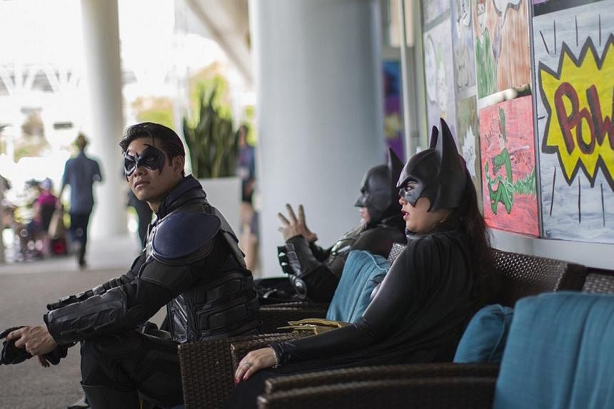 People dressed like characters from the Batman movies are pictured during the 2014 Comic-Con International Convention in San Diego, California on July 25, 2014. -- PHOTO: REUTERS