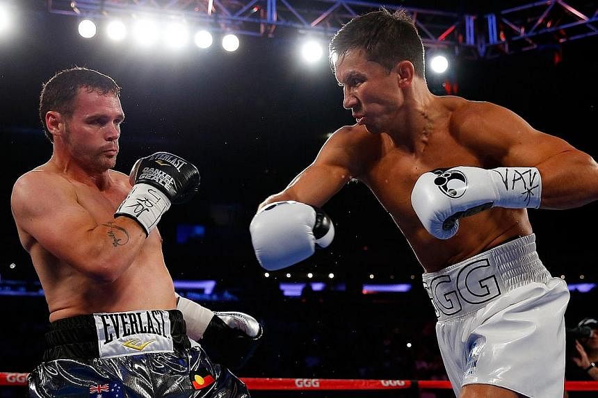 Gennady Golovkin punches Daniel Geale during the WBA/IBO middleweight championship bout at Madison Square Garden&nbsp;in New York City&nbsp;on July 26, 2014. -- PHOTO: AFP&nbsp;