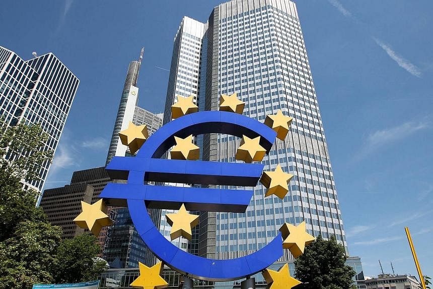 Picture taken on July 3, 2014 shows the logo of the European Euro currency standing in front of the European Central Bank (ECB) in Frankfurt am Main, western Germany.&nbsp;A group of professors has lodged a complaint with Germany's Constitutional Cou