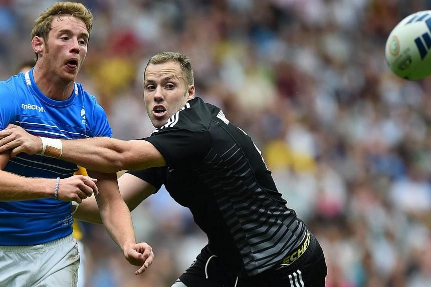 New Zealand's Tim Mikkelson (right) tackles Scotland's Scott Wrigh (left) during the Rugby Sevens pool A match between Scotland and New Zealand at Ibrox Stadium during the 2014 Commonwealth Games in Glasgow on July 26, 2014.&nbsp;Four-time champions 