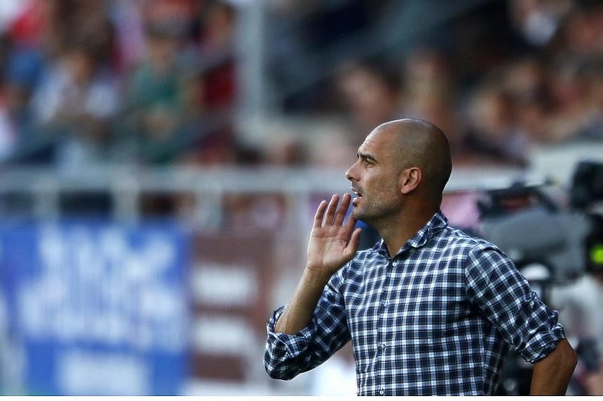 Bayern Munich will never push out their coach Pep Guardiola (above), club chief executive Karl-Heinze Rummenigge said in an interview published on Sunday, July 27, 2014. -- PHOTO: REUTERS