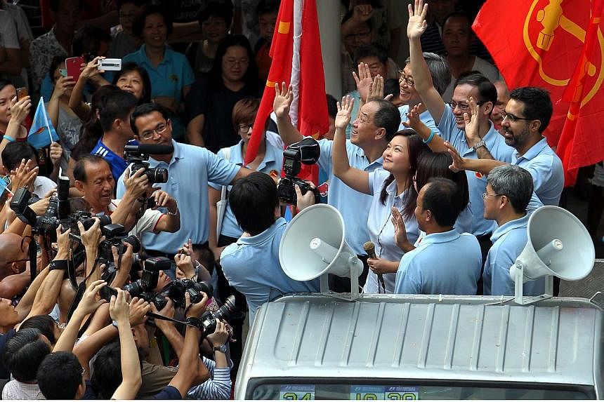 MP-elect Lee Li Lian, Workers' Party (WP) chief Low Thia Khiang, chairman Sylvia Lim, and other WP MPs waving to Punggol East residents during the party’s thank-you parade around the Punggol East ward.&nbsp;The Workers' Party (WP) on Sunday, July 2