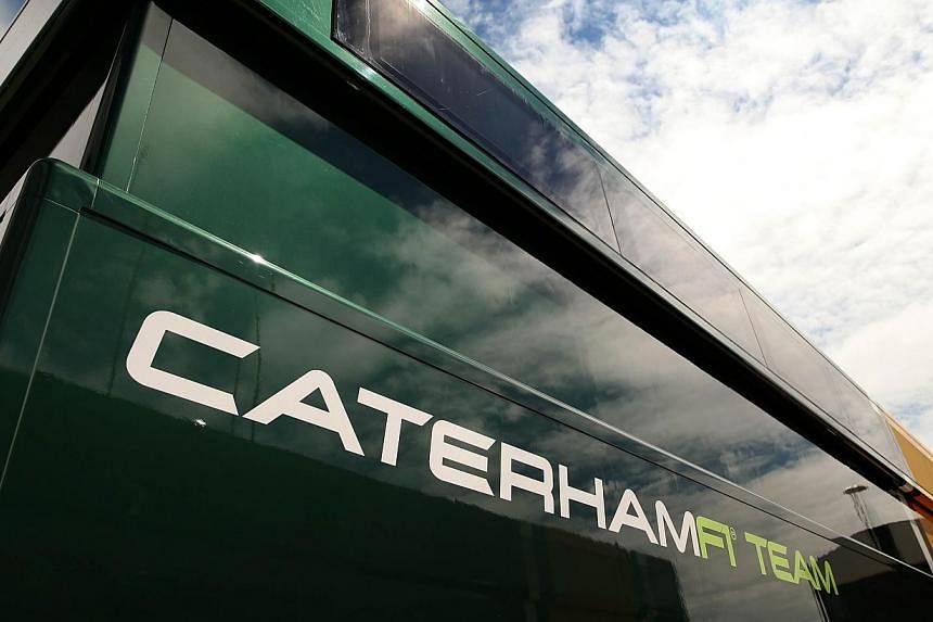 The struggling Caterham Formula One team faces possible legal action from a group of around 40 former staff who were axed by a new management team following this month's takeover. -- PHOTO: AFP&nbsp;