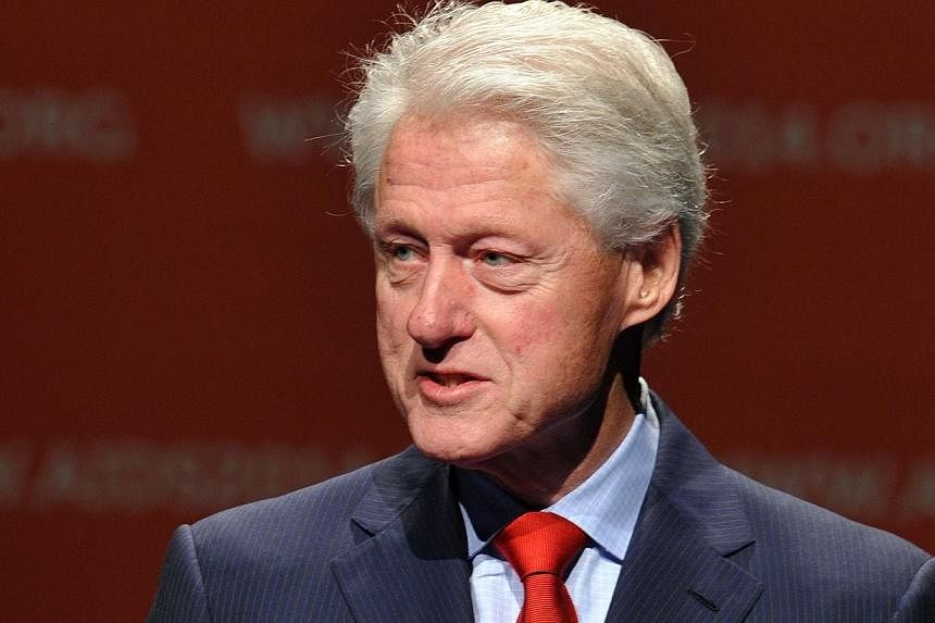 Former US president Bill Clinton addresses the 2014 AIDS Conference at the Melbourne Convention and Exhibition Centre (MCEC) in Melbourne on July 23, 2014. -- PHOTO: AFP
