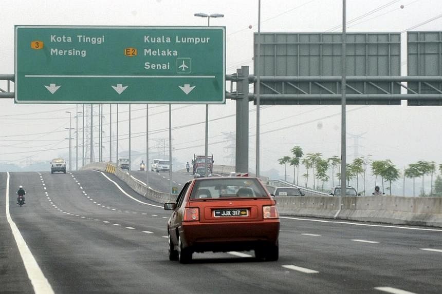 Vehicles travelling along the new Eastern Dispersal Link (EDL) highway in Johor Baru.&nbsp;At least 180,000 vehicles or about 80 per cent of Eastern Dispersal Link (EDL) motorists would not have to pay toll rates as they could exit at various points 