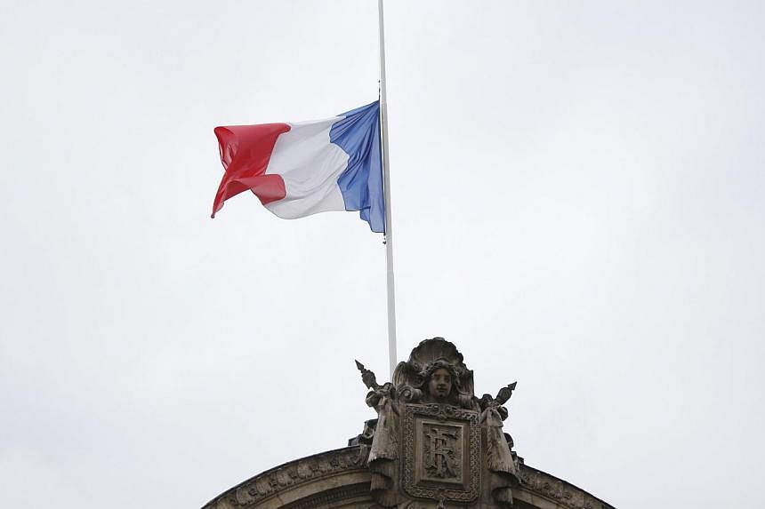 Flags flew at half-mast in France on Monday, July 28, 2014, in mourning for the 118 victims of the Air Algerie plane tragedy, as investigators waited for the black boxes from the crash to arrive. -- PHOTO: AFP&nbsp;
