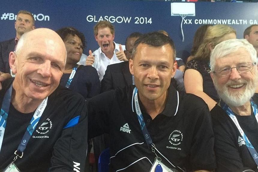 Britain's Prince Harry has followed his grandmother Queen Elizabeth II into the photobomb craze, giving the thumbs up in an image of acclaimed New Zealand rugby sevens coach Gordon Tietjens at the Commonwealth Games. --&nbsp;PHOTO: TREVOR SHAILER/FAC