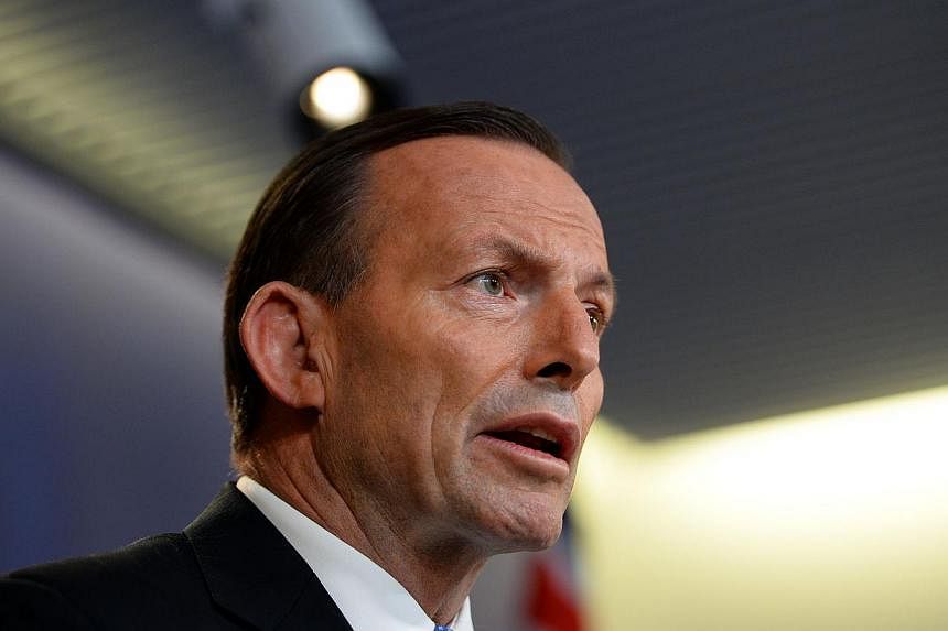 Australian Prime Minister Tony Abbott speaks at a press conference in Sydney on July 19, 2014.&nbsp;Embattled Australian Prime Minister Tony Abbott's forthright handling of the downing of Malaysia Airlines Flight MH17 appears to have paid off, a poll