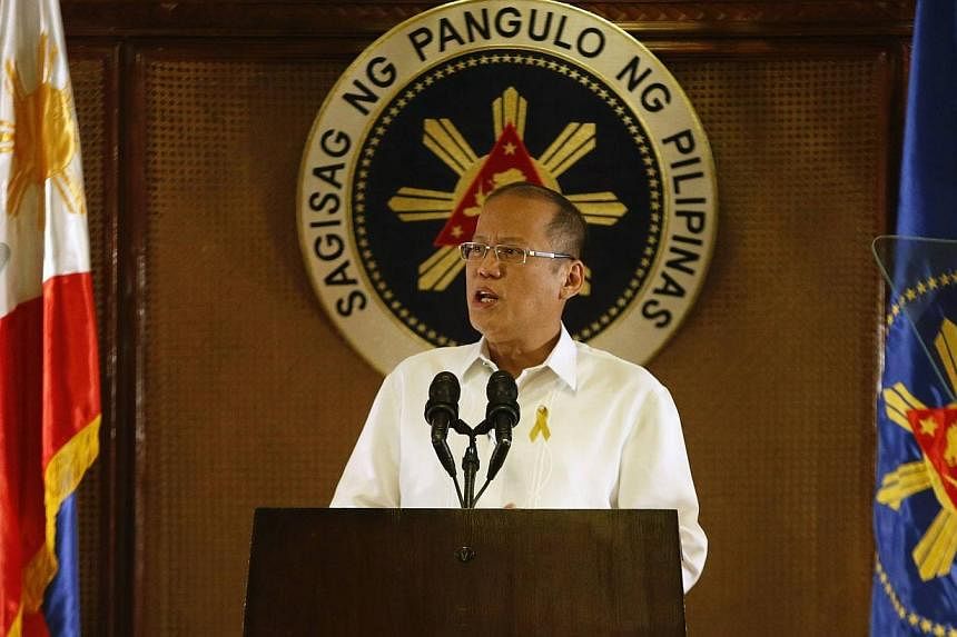 Philippine President Benigno Aquino addresses the nation in a live broadcast at the presidential Malacanang Palace in Manila, July 14, 2014. Mr Aquino sought on Wednesday to quash rumours that a coup is being plotted against him, with his spokesman i