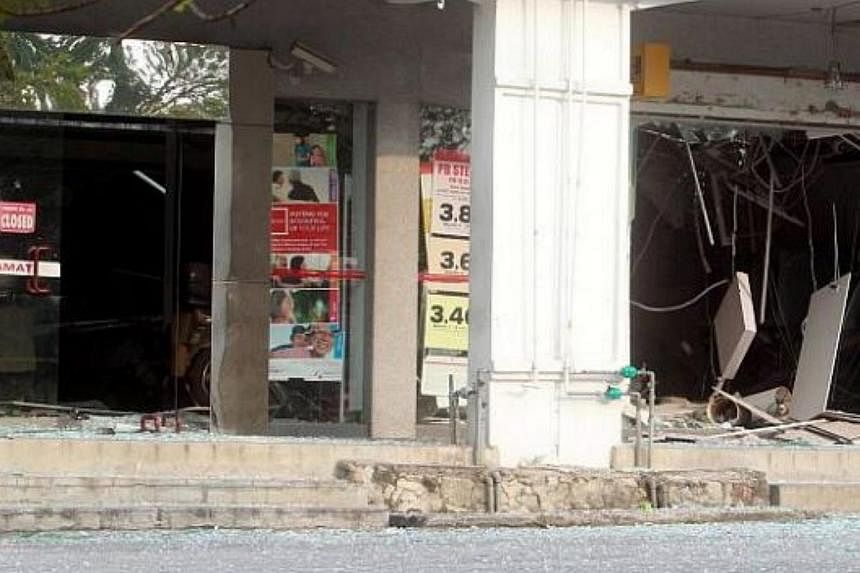 Robbers attempting to blast open an ATM at a bank in the quiet town of Bukit Beruntung brought down the ceiling at its service area and damaged several other machines. And, they got nothing. -- PHOTO: THE STAR/ASIA NEWS NETWORK