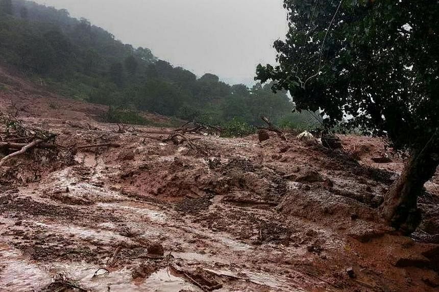 A major landslide on Wednesday struck a village in western India following heavy monsoon rains, killing at least 17 people and leaving up to 200 feared trapped, an official said. -- PHOTO: AFP