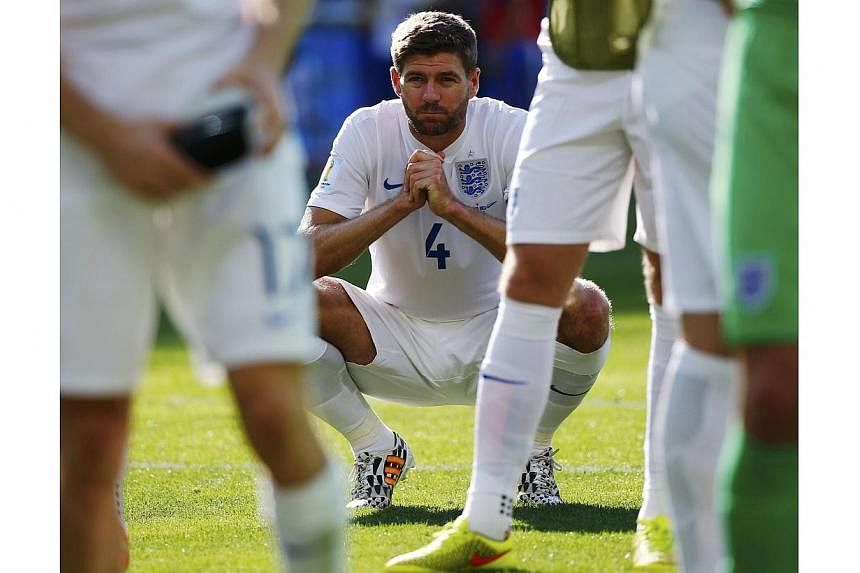 Steven Gerrard says the slip that arguably ended Liverpool's title hopes and England being knocked out of the football World Cup in the group stage have contributed to what has been "probably the worst three months of my life". -- PHOTO: REUTERS