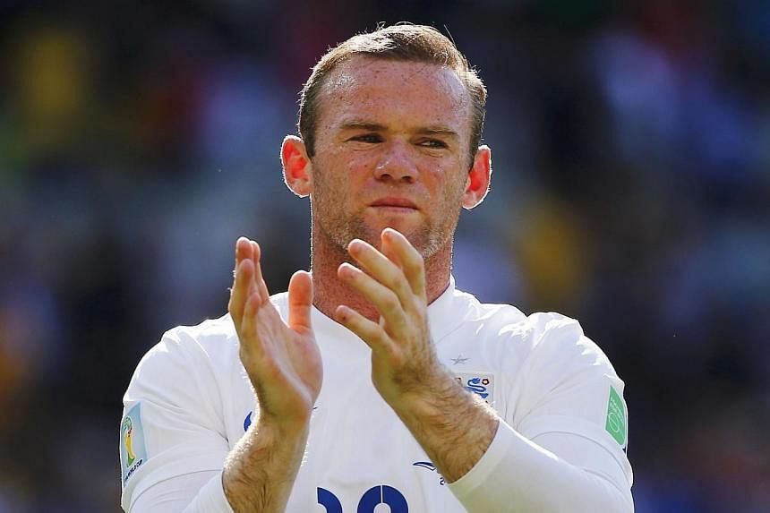 Wayne Rooney has what it takes to succeed Steven Gerrard as England's football captain, his former Manchester United teammate Rio Ferdinand believes. -- PHOTO: REUTERS