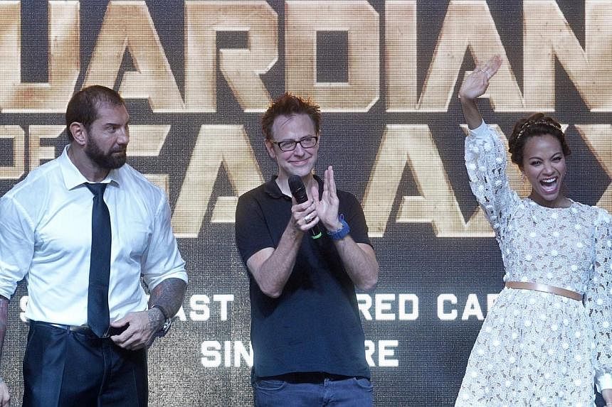 (From left) WWE wrestler Bautista, director James Gunn and Saldana were in Singapore last month for a cast visit. -- PHOTO: KEVIN LIM
