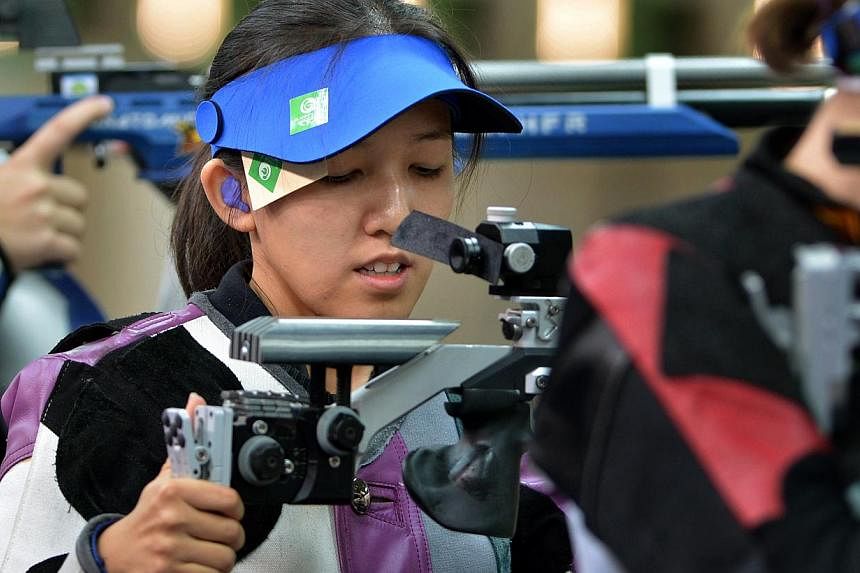 Singapore shooter Jasmine Ser at the 10m air rifle competition on 26 July 2014 in Glasgow, Scotland. She clinched Singapore's fourth gold medal at the Commonwealth Games early on Wednesday with a win in women’s 50m rifle three positions final. -- S