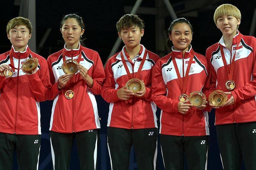 (From left) Feng Tianwei, Yu Mengyu, Lin Ye, Isabelle Li and Zhou Yihan of the Singapore women's team strikes gold at the Scotstoun Sports Campus in Glasgow, Scotland. -- ST PHOTO:&nbsp;KUA CHEE SIONG
