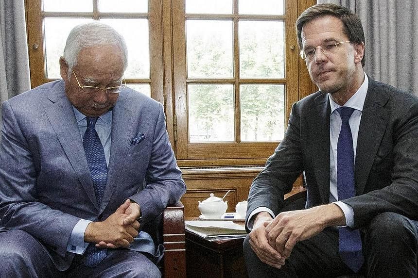Malaysian Prime Minister Najib Razak (left) and Dutch Prime Minister Mark Rutte (right) pose prior to their talks in The Hague on July 31, 2014. Mr Najib appealed on Thursday, July 31, 2014, for an "immediate cessation" of fighting between Ukraine go