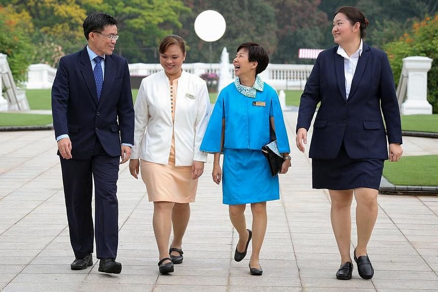 (From left) Mr Yong Keng Kwang, Madam Ng Wai May, Madam Sim Lai Kiow and Ms Karen Koh received the President's Award for Nurses from President Tony Tan Keng Yam at the Istana yesterday. -- ST PHOTO: ONG WEE JIN