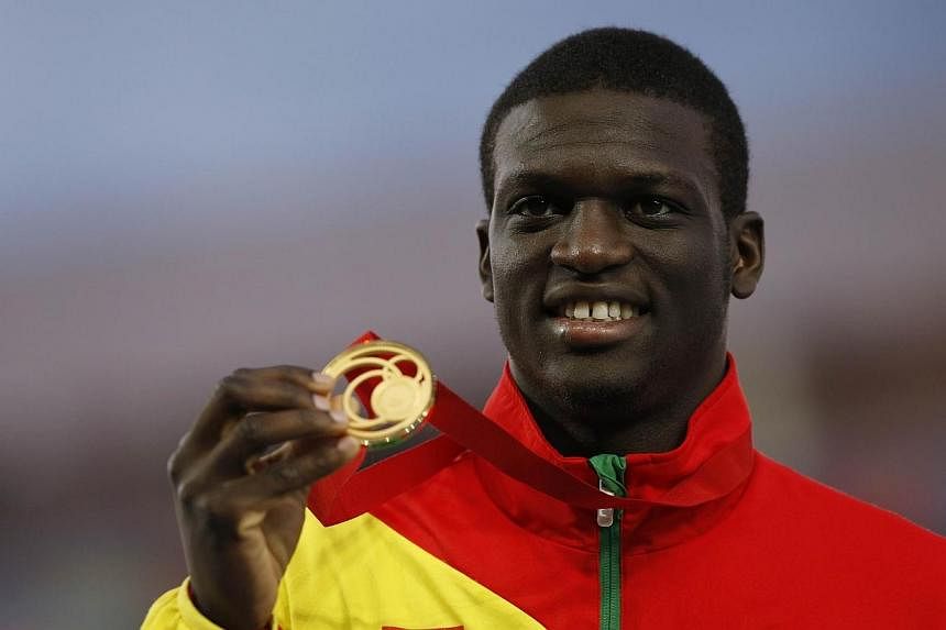 Gold medallist Kirani James poses on the podium during the award ceremony for the men's 400m athletics event at Hampden Park during the 2014 Commonwealth Games in Glasgow, Scotland on July 30, 2014.&nbsp;-- PHOTO: AFP