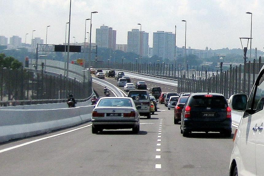 Cars travelling along the Causeway into Singapore from the Sultan Iskandar Customs, Immigration and Quarantine complex in Johor, Malaysia. -- PHOTO: BERITA HARIAN FILE