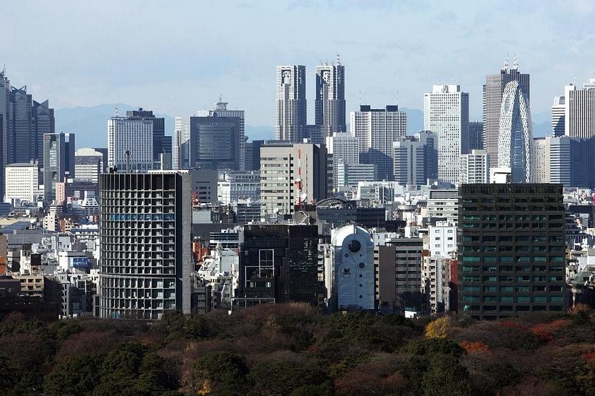 Residential and commercial buildings stand in Tokyo, Japan, on Friday, Dec 18, 2009.&nbsp;Japan's government will lower the corporate tax rate by 2 percentage points from next fiscal year as part of Prime Minister Shinzo Abe's drive to encourage dome
