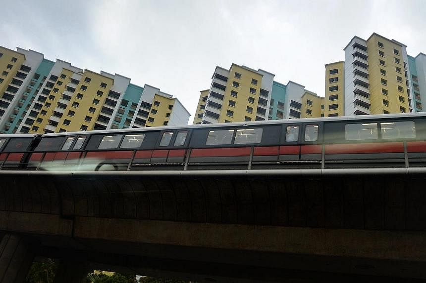 HDB blocks near the Clementi MRT track along Clementi West Avenue.&nbsp;Commuters at Clementi MRT station can look forward to less congested entrances when upgrading works are completed by the middle of next year. -- PHOTO: ST FILE