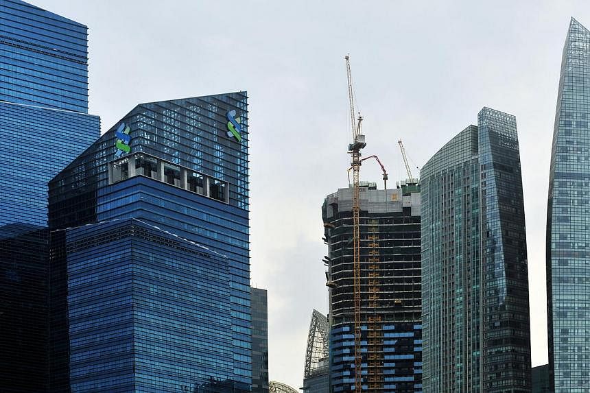 Total bank lending in Singapore was barely changed in June from May as loans to building and construction grew while lending to general commerce and manufacturing fell, central bank data showed on Thursday. -- PHOTO: ST FILE