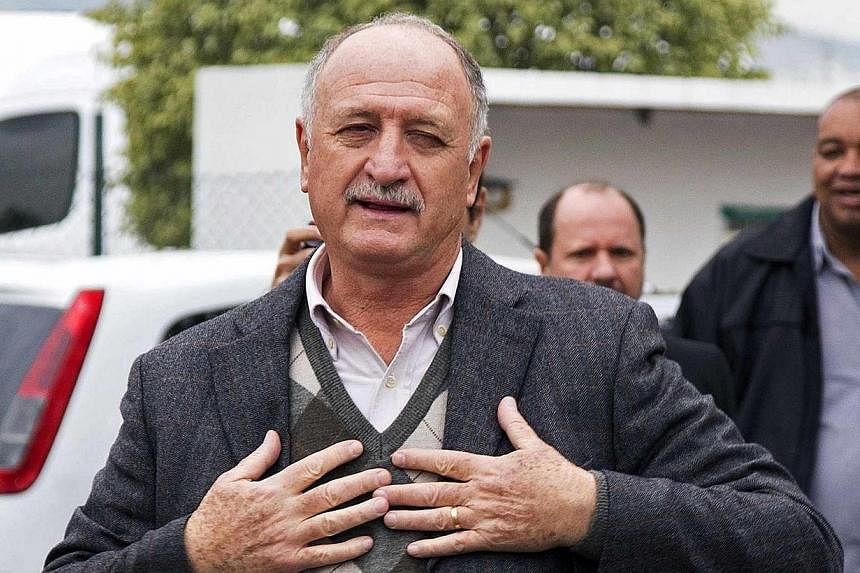 Brazil's former national team coach Luiz Felipe Scolari arrives at the Salgado Filho airport, before being presented to the media as the new coach of Gremio, in Porto Alegre, on July 30, 2014.&nbsp;Scolari said he needed a hug and some affection as t