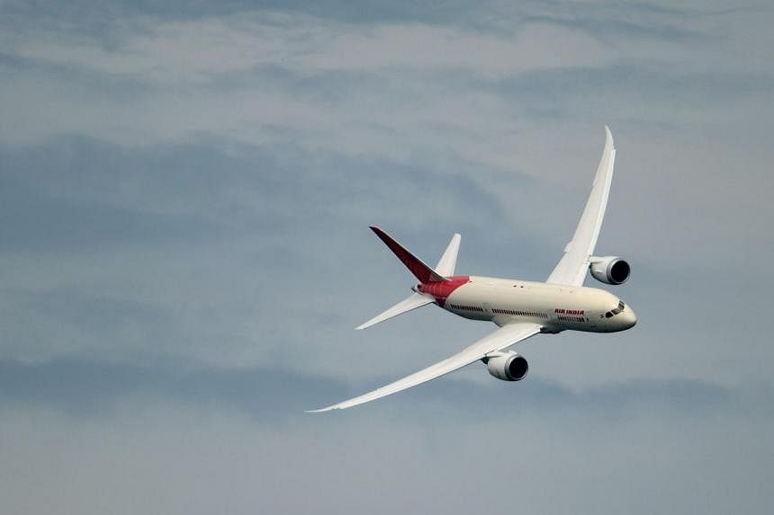 An Air India Boeing 777 Dreamliner is pictured on June 20, 2013,&nbsp;in flight over Le Bourget airport near Paris during the 50th International Paris Air show. -- PHOTO: AFP