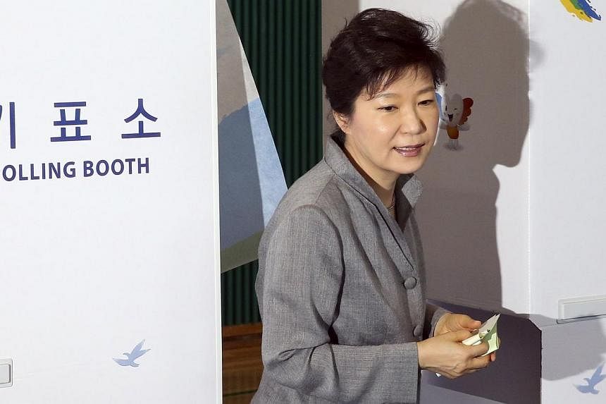 South Korean President Park Geun Hye walks out a voting booth after marking her ballots for the local elections at a polling station in Seoul on June 4, 2014.&nbsp;South Korea's ruling party celebrated on Thursday after sailing through a key by-elect