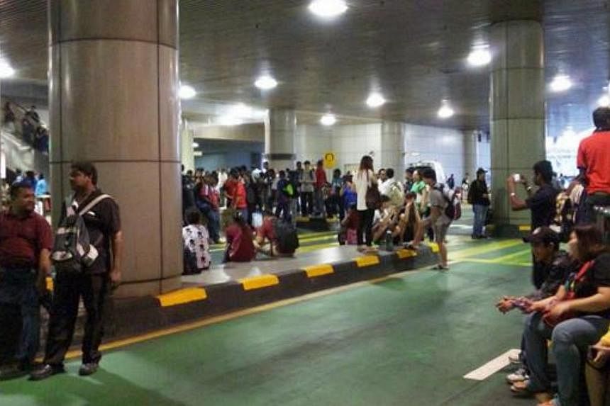 A Twitter user posted this picture of commuters apparently stranded at the Checkpoint. --&nbsp;PHOTO: SHING/TWIITER