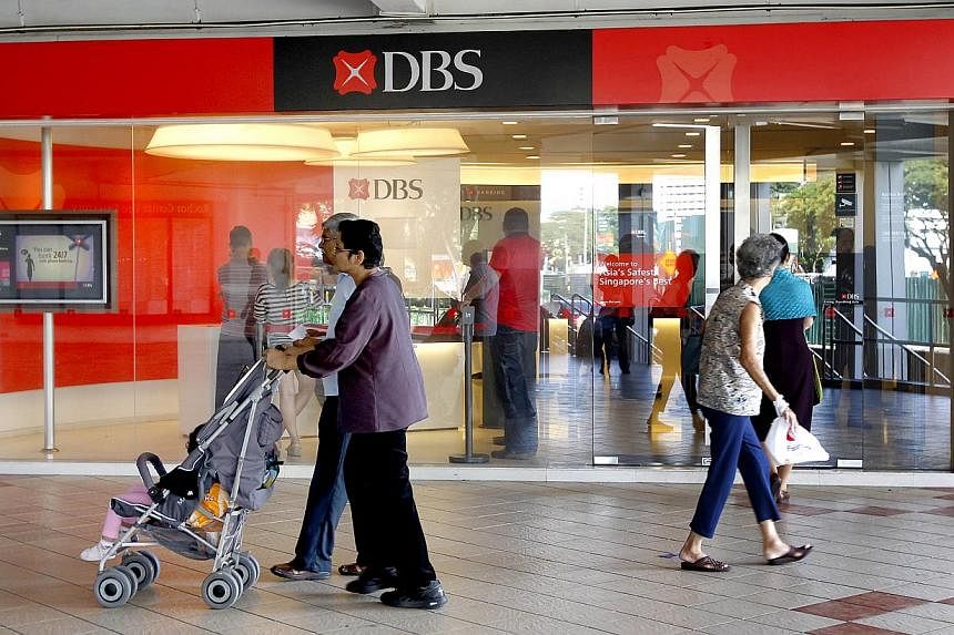 People walking pass a DBS bank branch at Rochor Centre. -- PHOTO: ST FILE