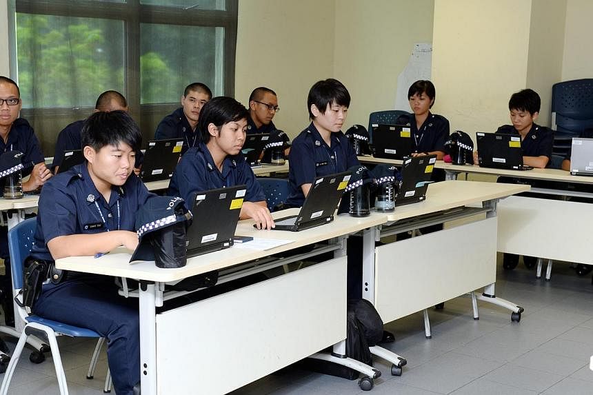 Trainees from the Singapore Police Force at a classroom lesson at the Home Team Academy in Choa Chu Kang. An independent review panel that will look at whether internal investigations into Home Team officers are thorough and fair was established by t