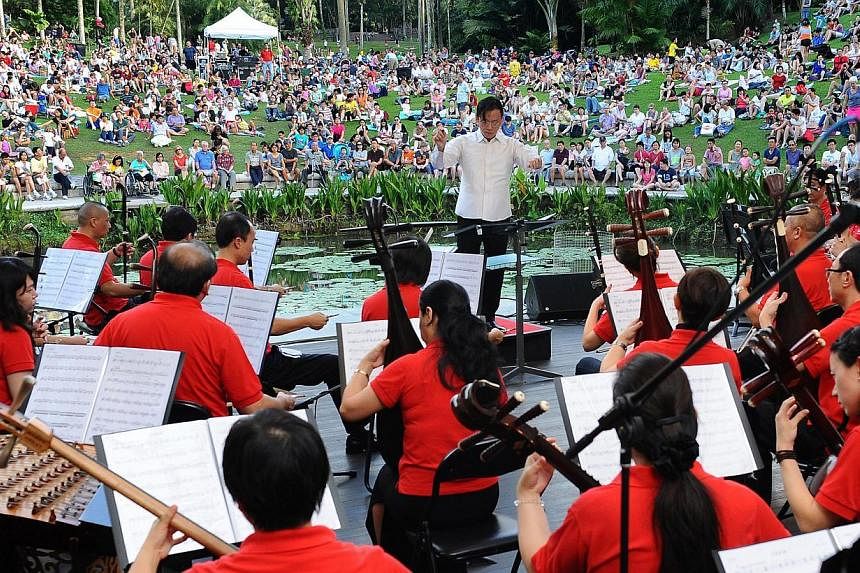 The Singapore Chinese Orchestra performing at the Botanic Gardens, led by resident conductor Quek Ling Kiong. -- PHOTO:&nbsp;SINGAPORE CHINESE ORCHESTRA