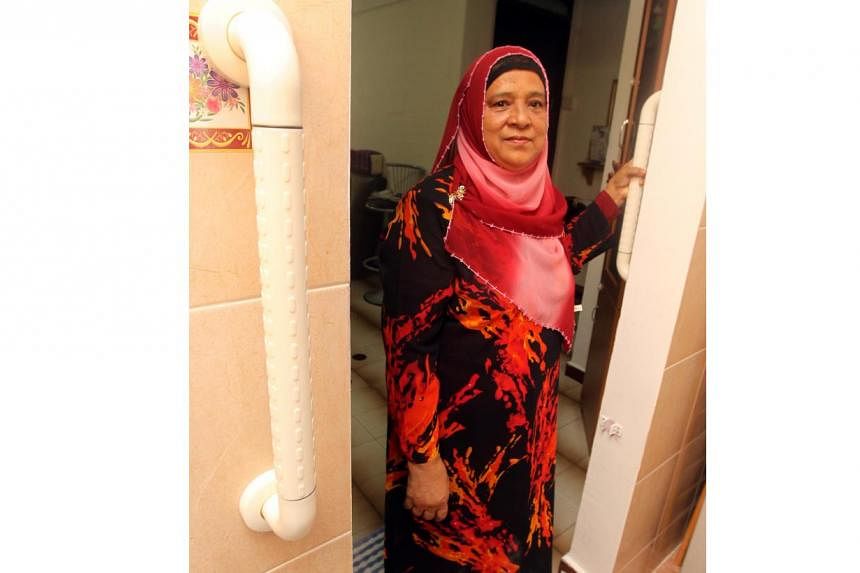 Madam Hajara Mohamed standing at the entrance of a bathroom in her three-room HDB flat in Bedok North on 22 Nov 2012. Equipped with elderly friendly features, Madam Hajara's flat was chosen under the Home Improvement Programme (HIP) and Enhancement f