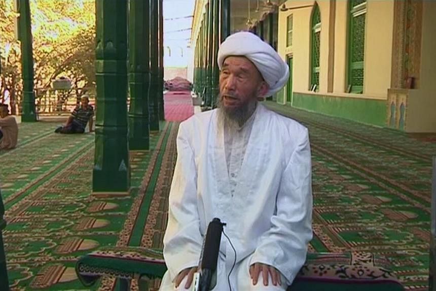 Jume Tayir speaks during an interview at Id Kah Mosque in Kashgar in this still image taken from video dated on Aug 3, 2011. -- PHOTO: REUTERS