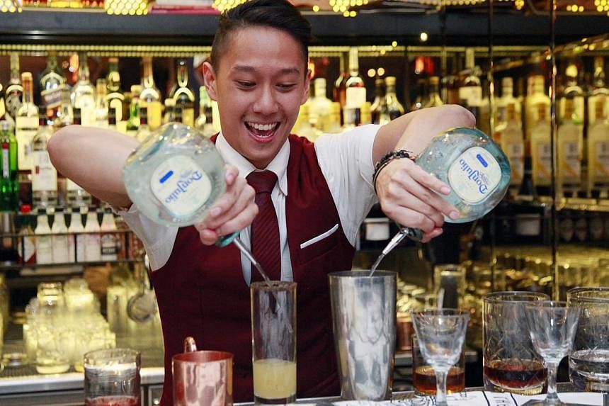 Local barman Peter Chua flew the flag high for his country at one of the most prestigious international bartending competitions held in Edinburgh and London. -- PHOTO: DIAGEO&nbsp;