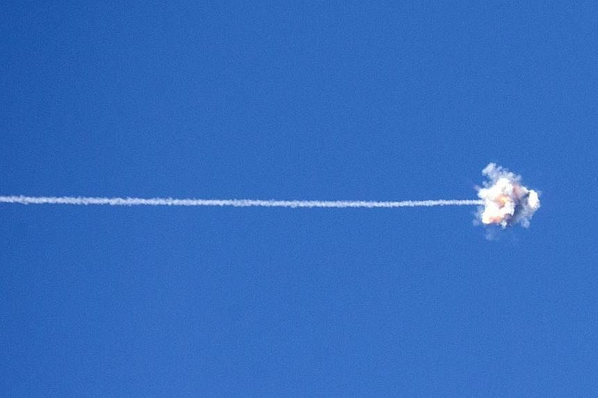 The trail of a missile launched by Israel's Iron Dome defence system is seen as it intercepts and destroys a rocket launched from Gaza into Israel, on July 21, 2014. The US Congress has approved US$225 million (S$280 million) in emergency funding for