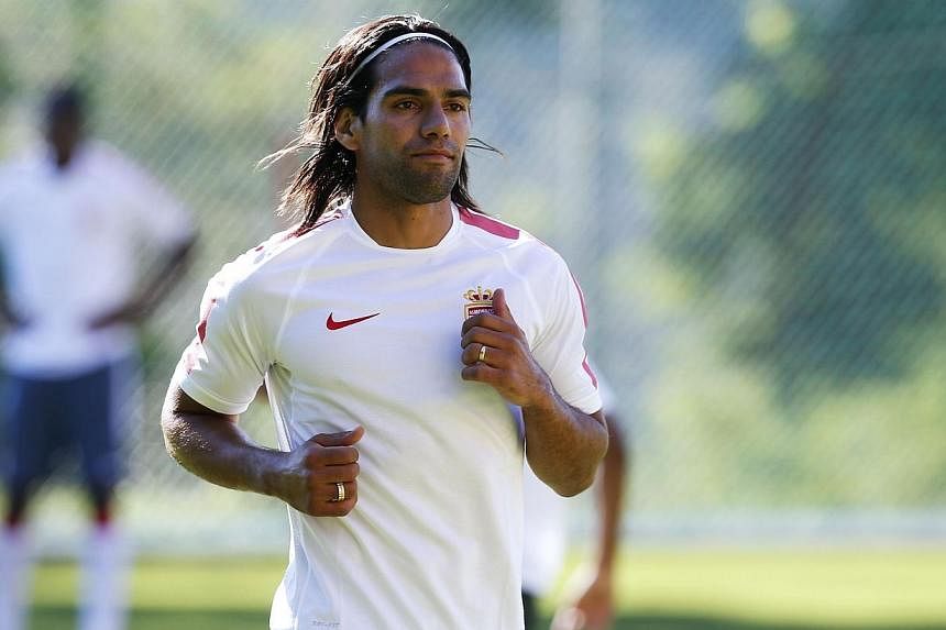 Monaco's Colombian forward Radamel Falcao runs during Monaco's (ASM) first team training session on June 30, 2014 at the Monaco training camp in La Turbie, south-eastern France. -- PHOTO: AFP
