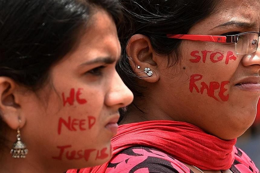 Indian activists participate in a rally organised by The Red Brigade - Bring Bangalore Back campaign to protest against the recent incidents of sexual abuse, molestation and rapes against women in Bangalore&nbsp;on July 20, 2014. -- PHOTO: AFP